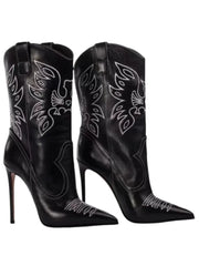 Close-up of black embroidered pointed stiletto cowboy boots