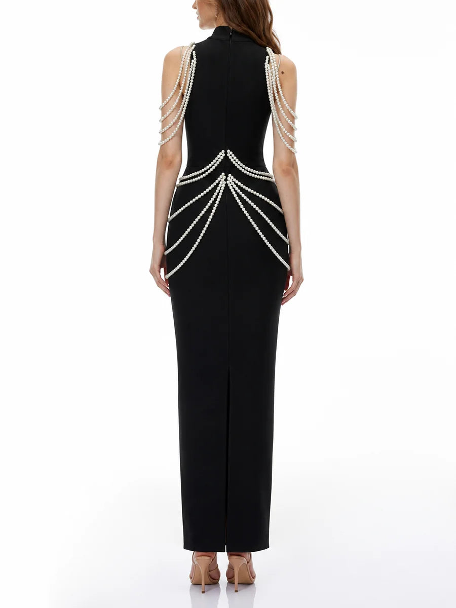 Back view of black high neck sleeveless maxi dress with pearl and crystal embellishments