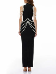 Back view of black high neck sleeveless maxi dress with pearl and crystal embellishments