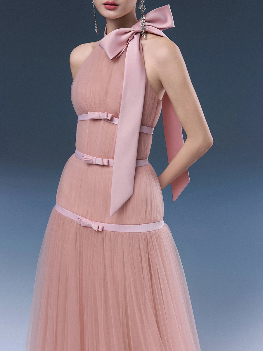 Pink halter bow tulle maxi dress close-up neckline