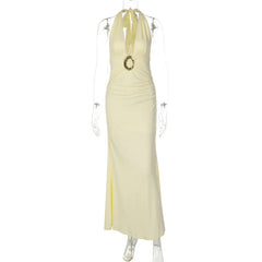 Yellow evening gown on a mannequin against a white background