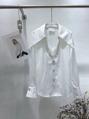 White shirt on a hanger with a small photo of a woman in a white shirt in the corner.