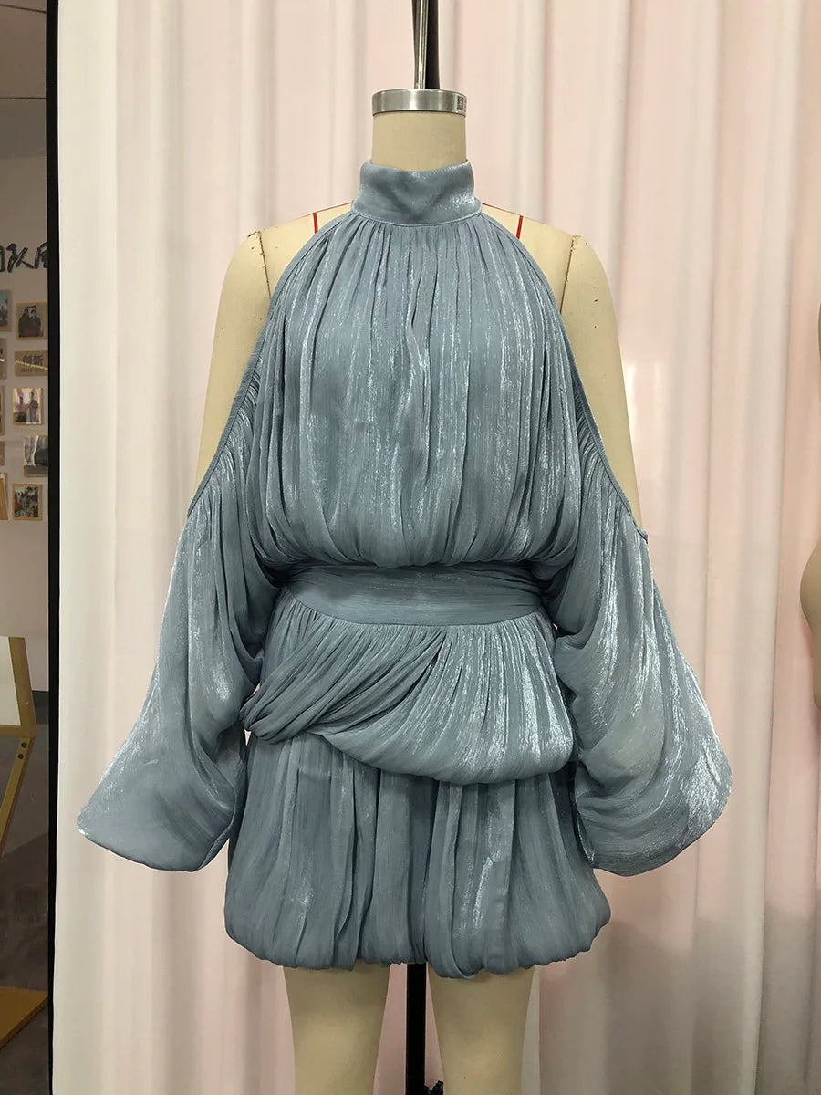 Blue pleated mini dress on a mannequin against a neutral background