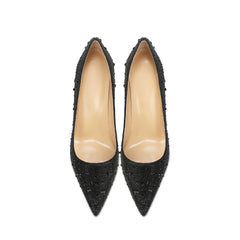 Pair of black pointed-toe high heels 