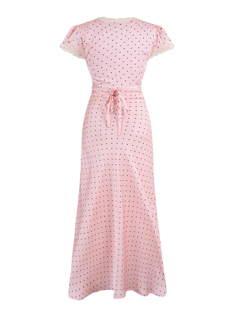 Pink polka dot dress on a white background