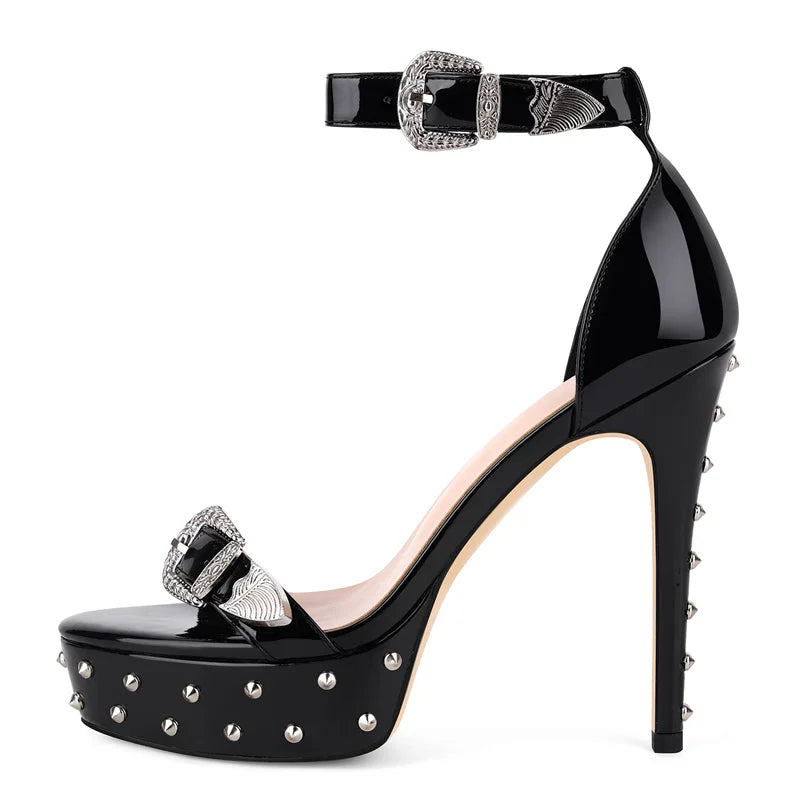 Black high-heeled shoe with studded details on a white background