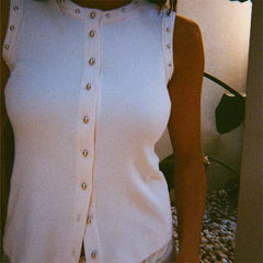 Close-up of a white studded ribbed knit sleeveless top with button front
