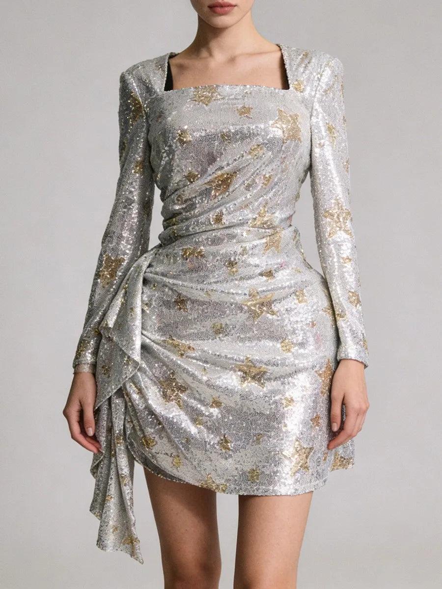 Silver sequin dress with long sleeves on a plain background