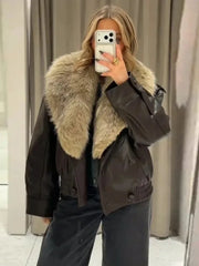 Faux leather bomber jacket with a large beige faux fur collar worn by a model