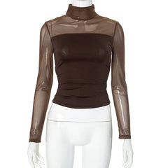 Brown sheer long-sleeve top on a mannequin with white pants against a white background