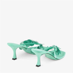 Side view of aqua green heeled thong sandals showcasing the stiletto heel.