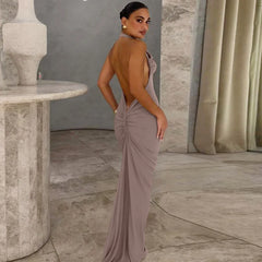 Woman in a elegant dress standing in a marble interior setting