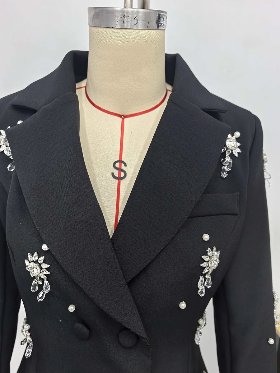 Black blazer with decorative elements on a mannequin against a white background