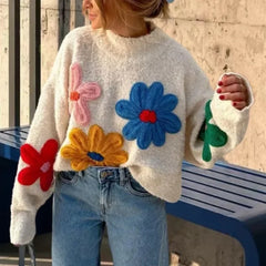 A model wearing a loose-fitting White crochet sweater with embroidered flowers and lantern sleeves. Golden Atelier 1