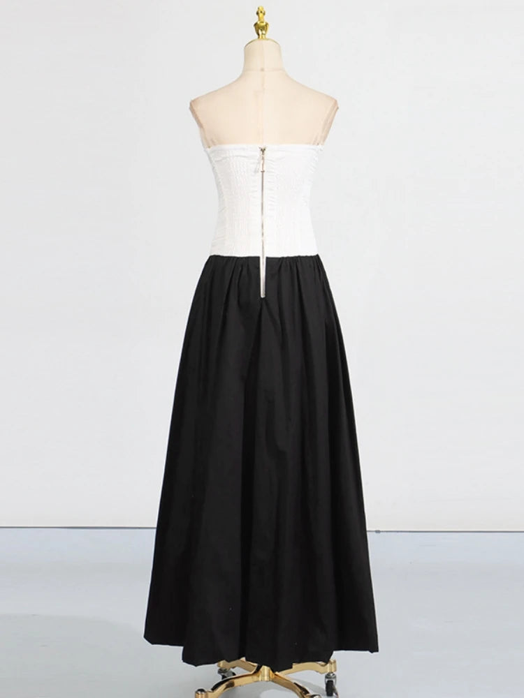 Black and white dress on a mannequin against a white background