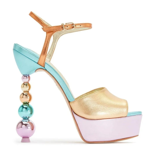 Side profile of a color block platform sandal featuring a beaded stiletto heel.