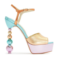 Side profile of a color block platform sandal featuring a beaded stiletto heel.