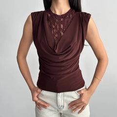Brown sleeveless top with lace detail worn by a person on a plain background