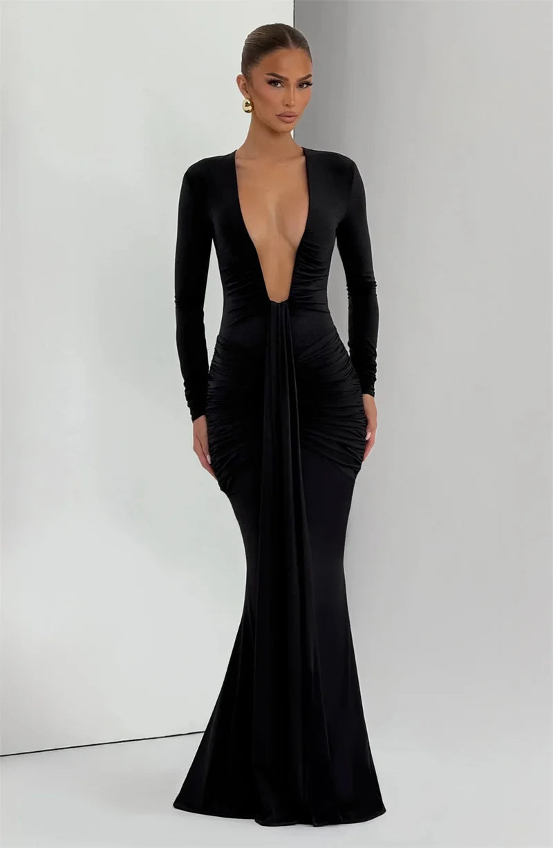 Black evening gown with long sleeves on a white background