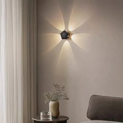  Sleek 4-sided LED wall sconce emitting warm light upwards and downwards. Golden Atelier 4