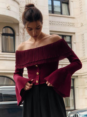  Woman wearing an Off-Shoulder Knitted Flare Sleeve Top