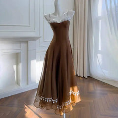 Brown lace-trimmed A-line midi dress on mannequin