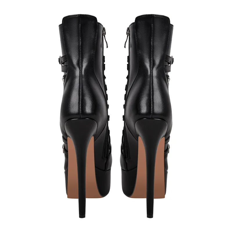 Rear view of black platform stiletto ankle boots with chain detail