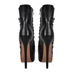 Rear view of black platform stiletto ankle boots with chain detail