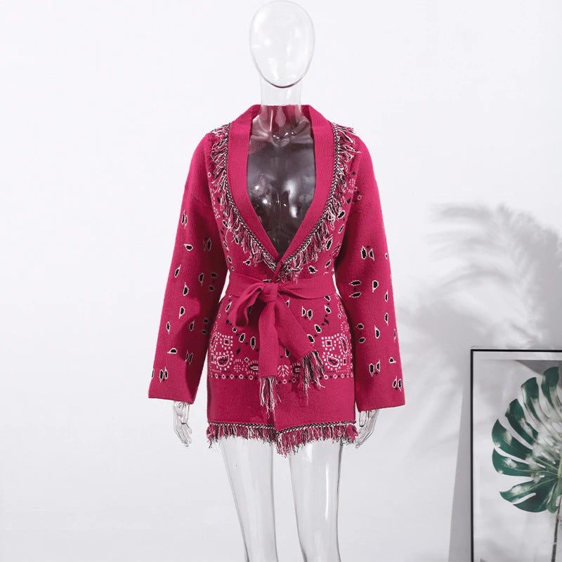 Pink patterned coat on a mannequin against a white background