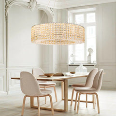 A stunning champagne crystal bead chandelier illuminating a modern dining room.  Golden Atelier 4