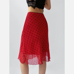 Red polka dot A-line midi skirt styled with a lace top