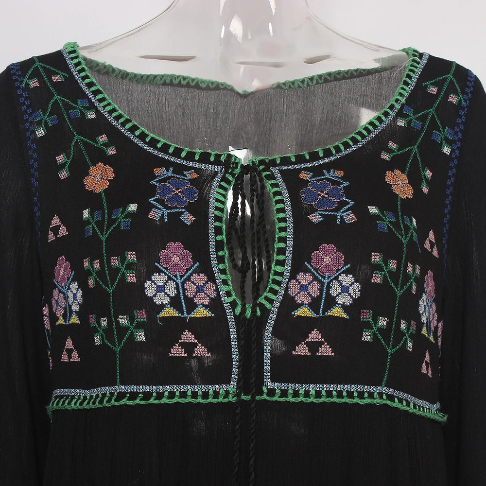 Black embroidered garment on a mannequin 