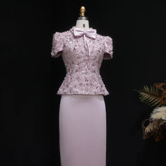 Lavender sequin top on a mannequin against a black background