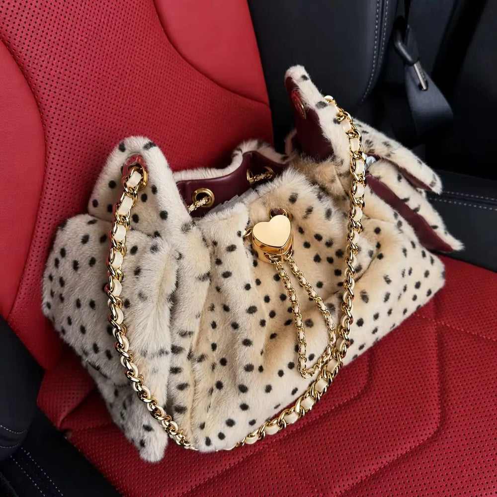Leopard print faux fur bucket bag with gold chain strap and heart clasp