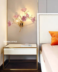 Nordic-style bedroom with a nightstand, wall lamp, and bed.