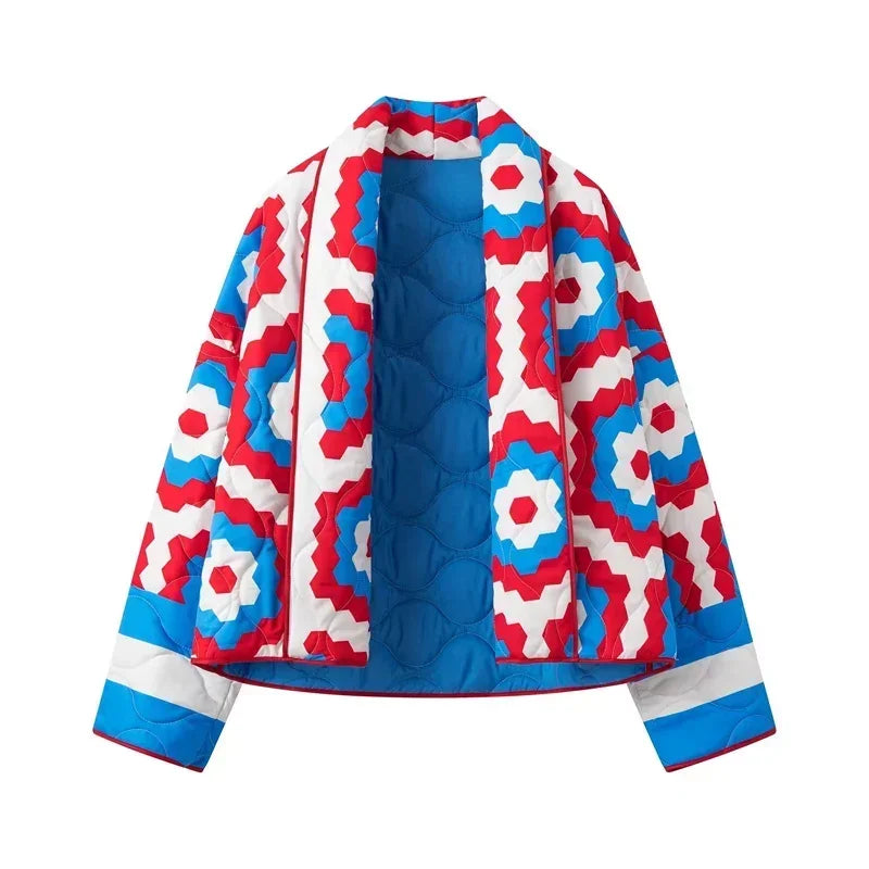 Flat lay of a geometric quilted kimono jacket.
