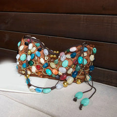 Brown satin shoulder bag adorned with colorful stones and gold beads.