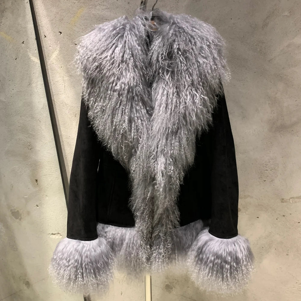 Black jacket with gray fluffy trim on a concrete wall background