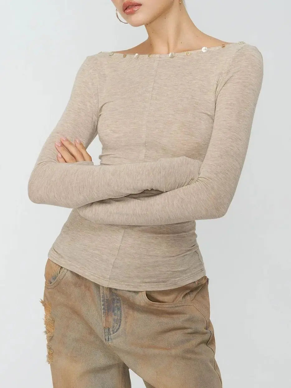 Ruched boat neck long sleeve top with crossed arms