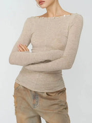 Ruched boat neck long sleeve top with crossed arms