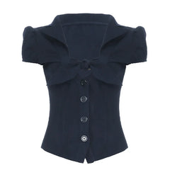 Navy blue top with a large bow on a white background