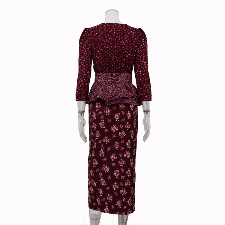 Mannequin wearing a burgundy floral dress on a white background