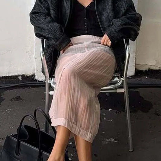 Sheer pleated slit midi skirt on chair
