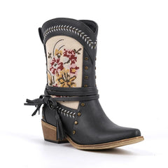 Black embroidered western ankle boots with floral detailing and wrap strap.