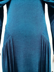 Teal dress with long sleeves and pleated skirt on a white background