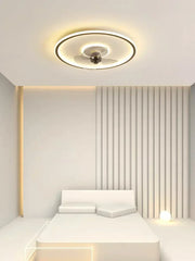 A modern LED ceiling fan with integrated light fixture, illuminating a stylish Dining room. Golden Atelier 2