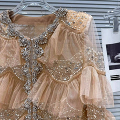 Close-up of beadwork on Ruffled Beaded Mesh top