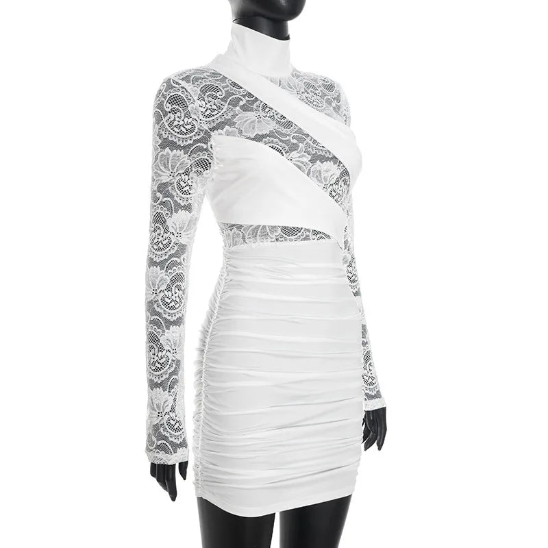 White dress with lace detailing on a mannequin against a white background