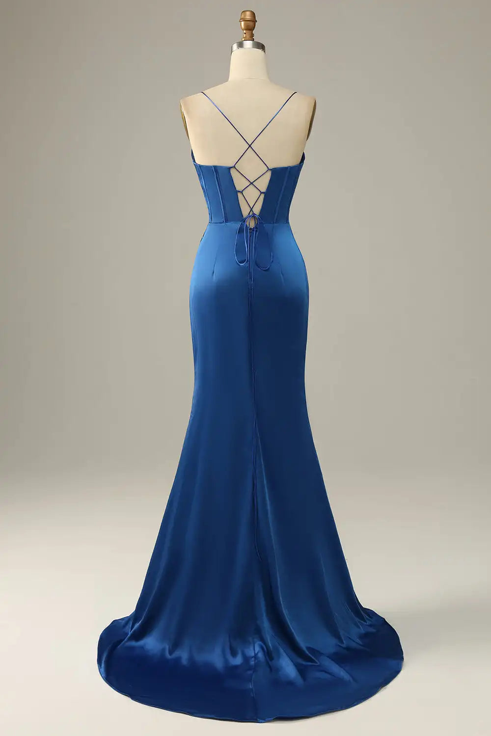 Blue evening gown on a mannequin against a neutral background