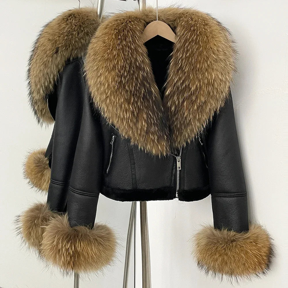 Black leather jacket with brown fur trim on a white background
